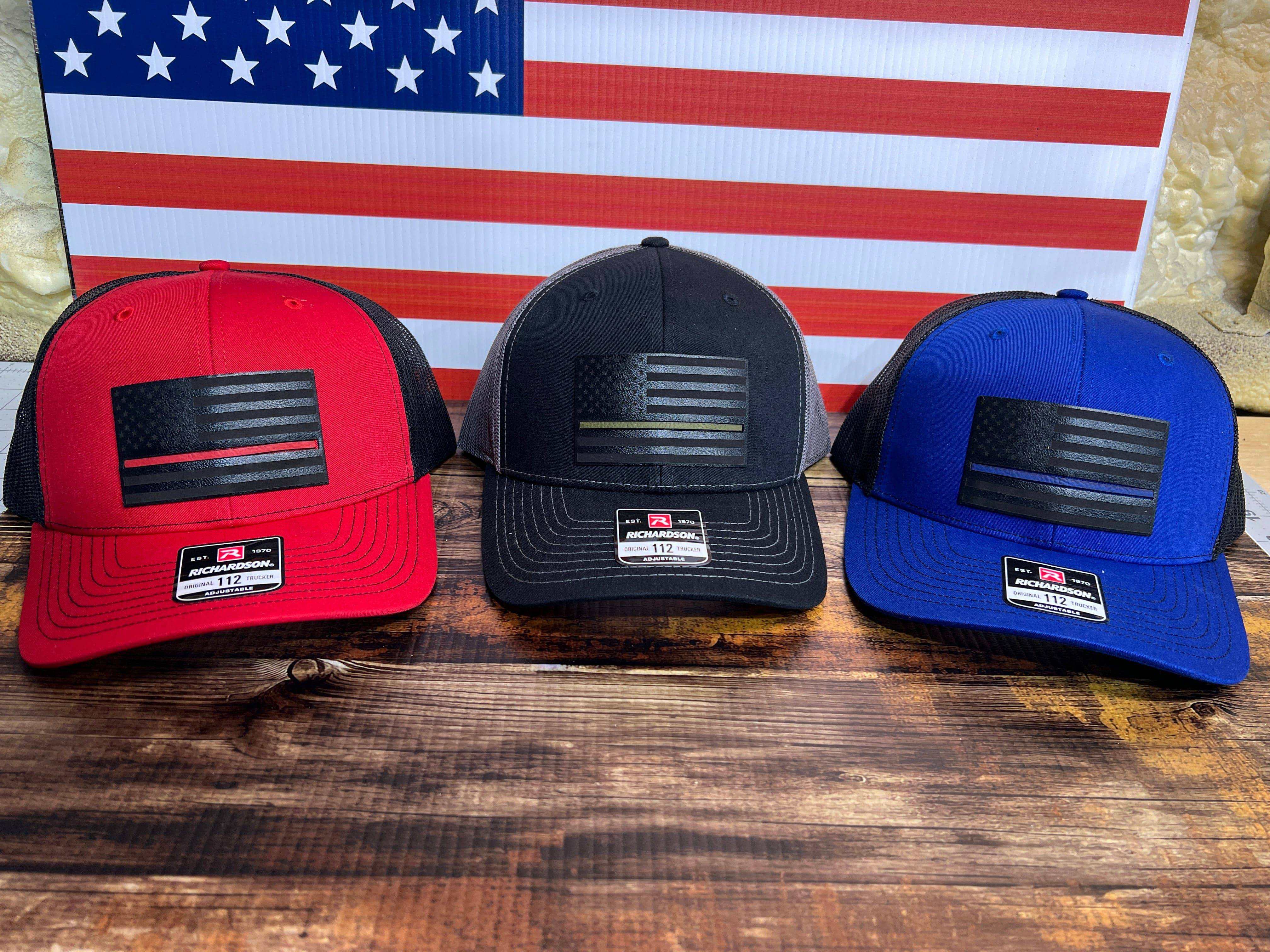 Thin Line Leatherette patch on Richardson 112 trucker hat with mesh back and laser-engraved American flag designs