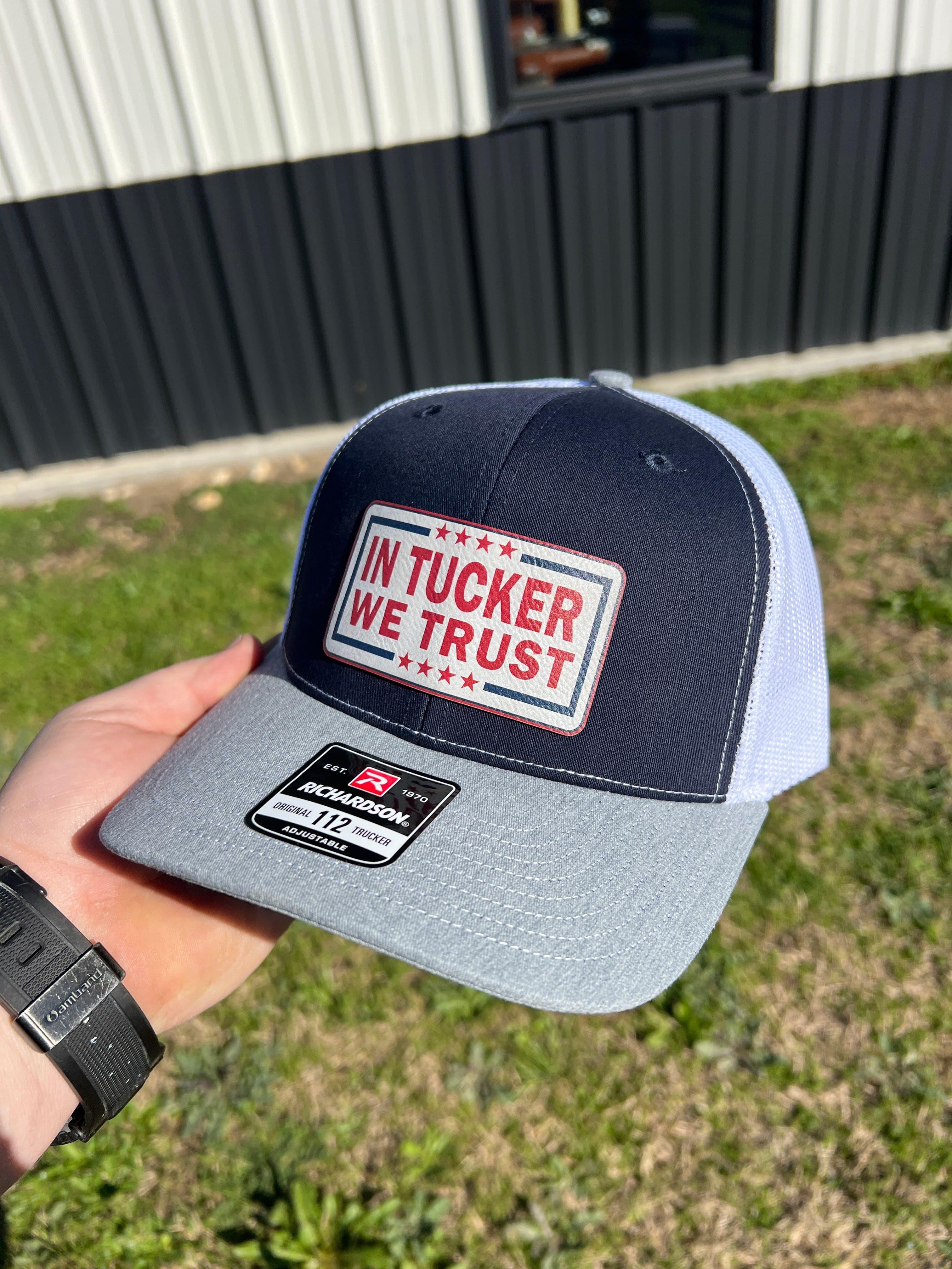 In Tucker We Trust Hat with Laser Engraved Premium Leatherette Patch on a Richardson 112 Trucker Hat. - F5 Custom Designs