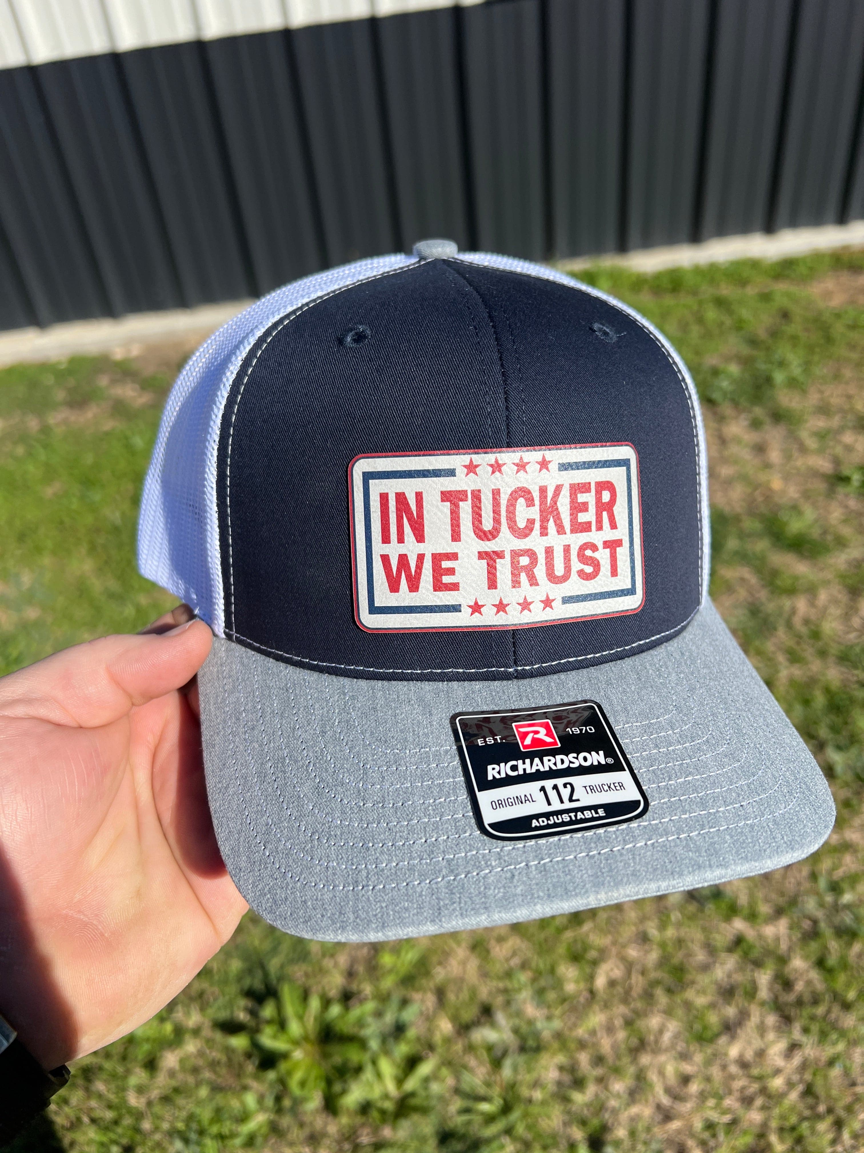 In Tucker We Trust Hat with Laser Engraved Premium Leatherette Patch on a Richardson 112 Trucker Hat. - F5 Custom Designs