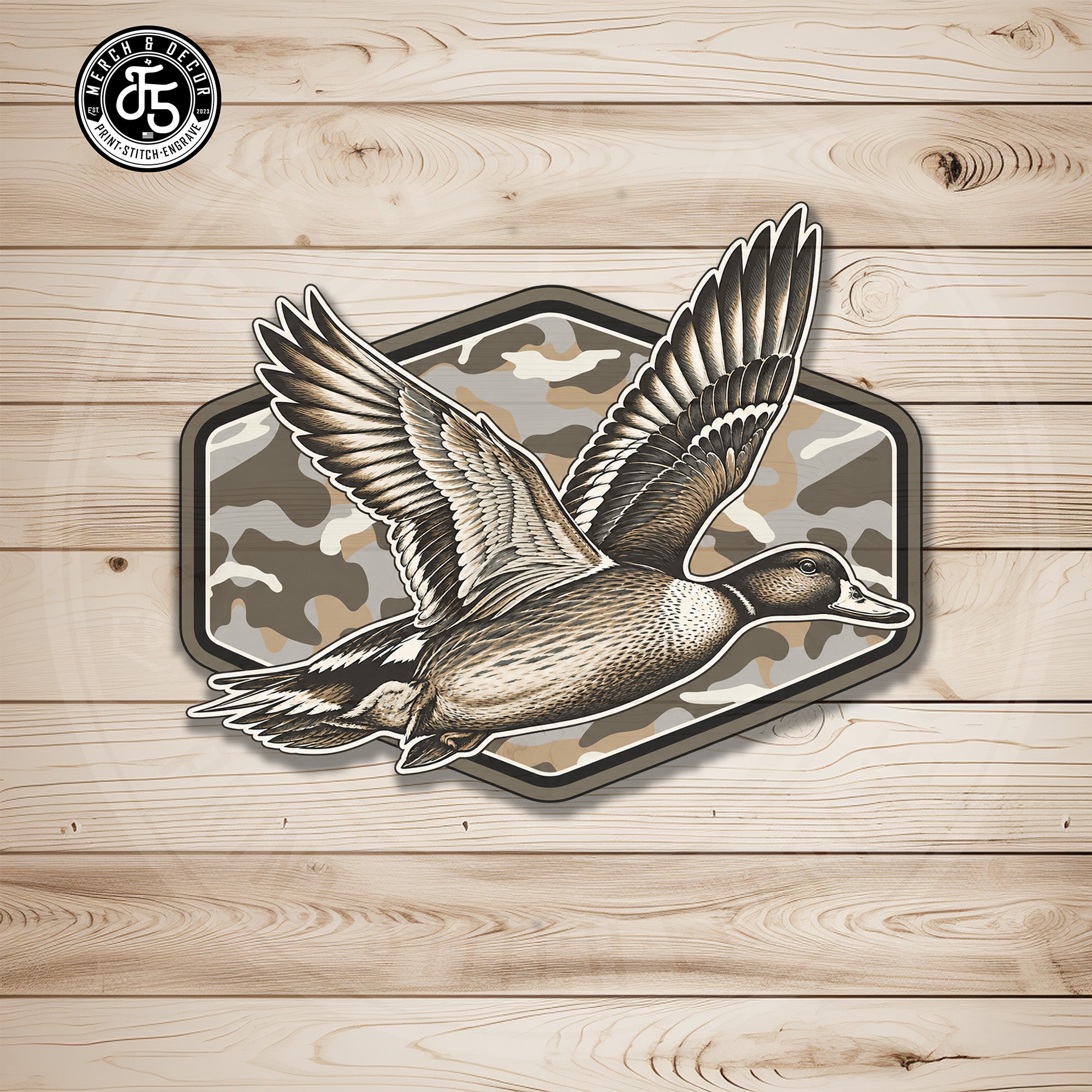 Duck hunting camo UV printed leatherette hat patch with flying mallard on light wood background
