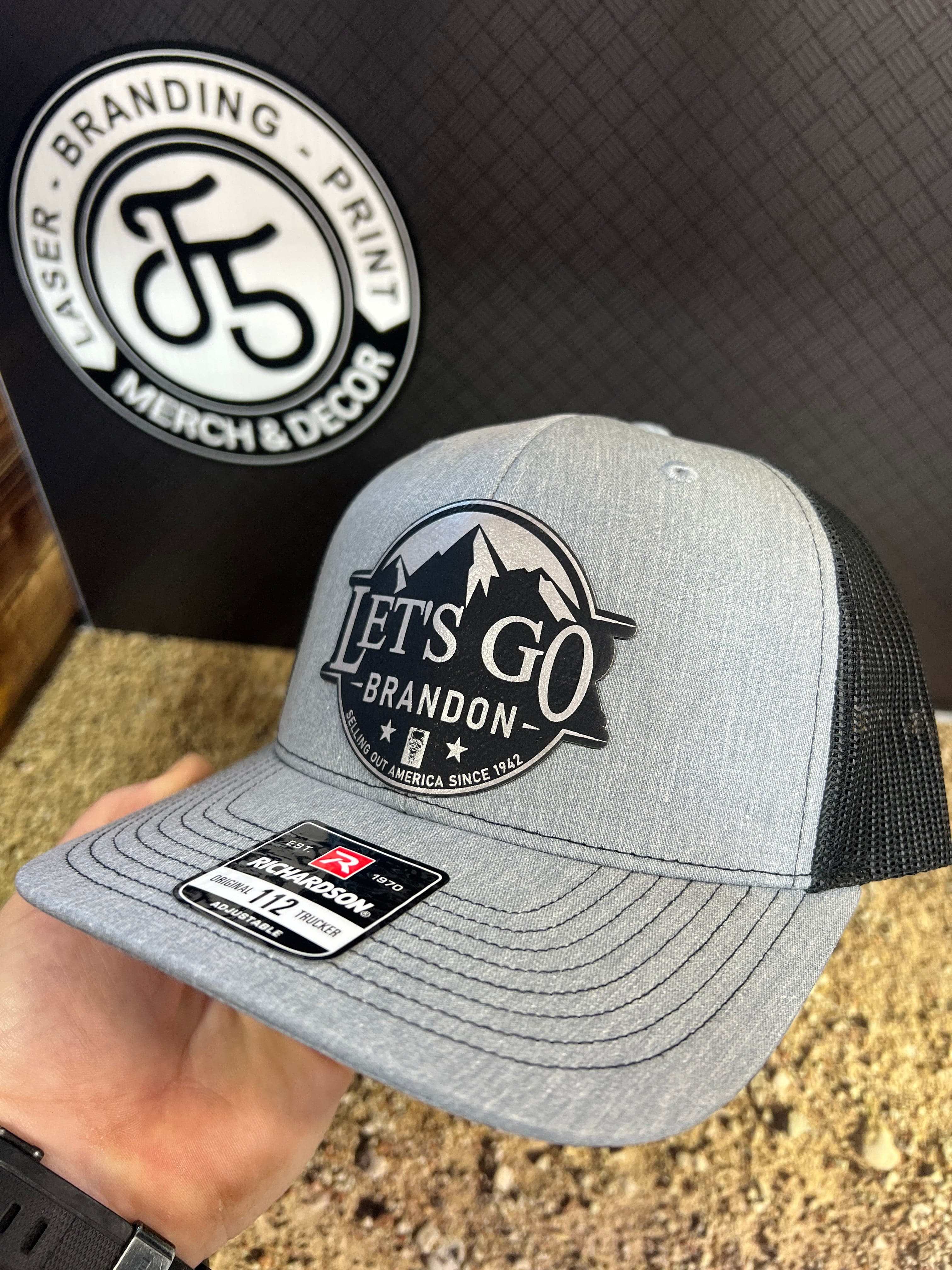 Let's Go Brandon Hat on Richardson 112 Trucker Hat with premium leatherette patch for patriotic Americans