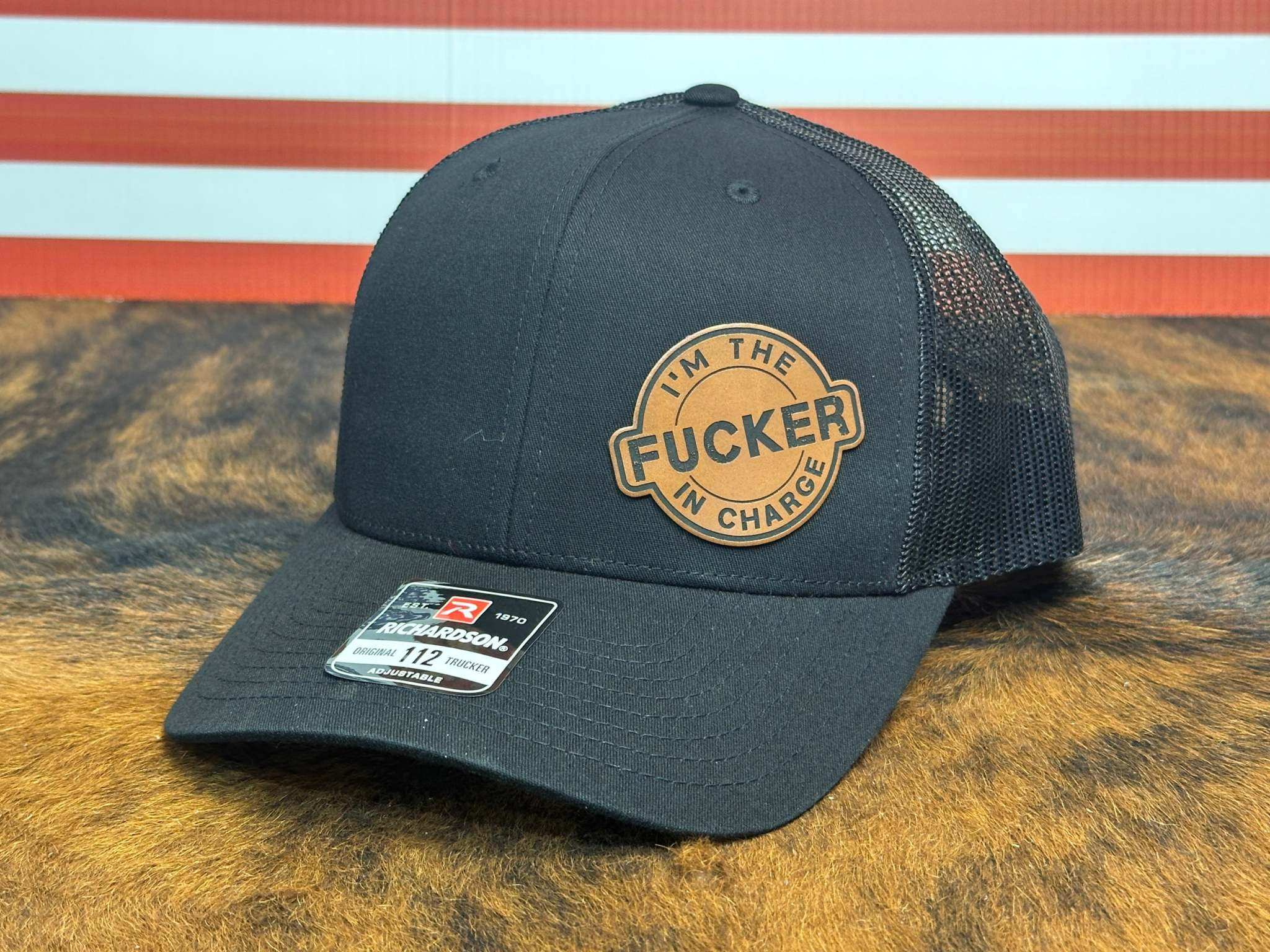 I'm the Fucker in Charge 112 Snapback Trucker Hat with premium leatherette patch and adjustable fit