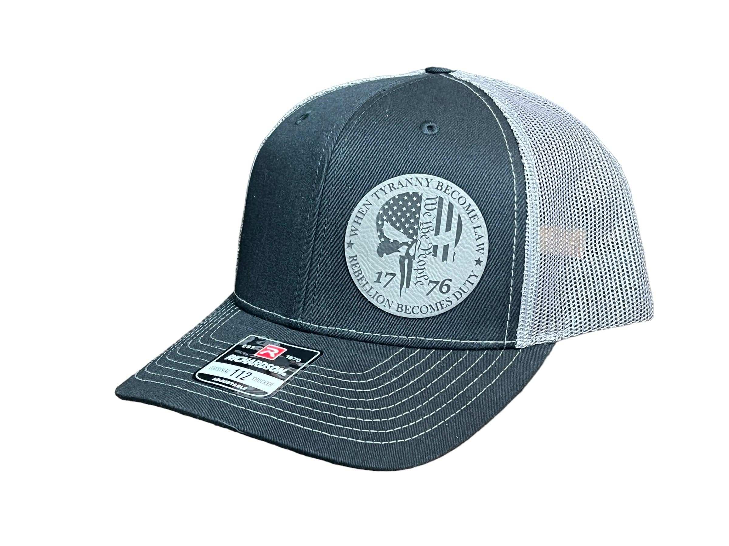 When Tyranny Becomes Law Richardson 112 trucker hat in multiple colors with rebellious slogan