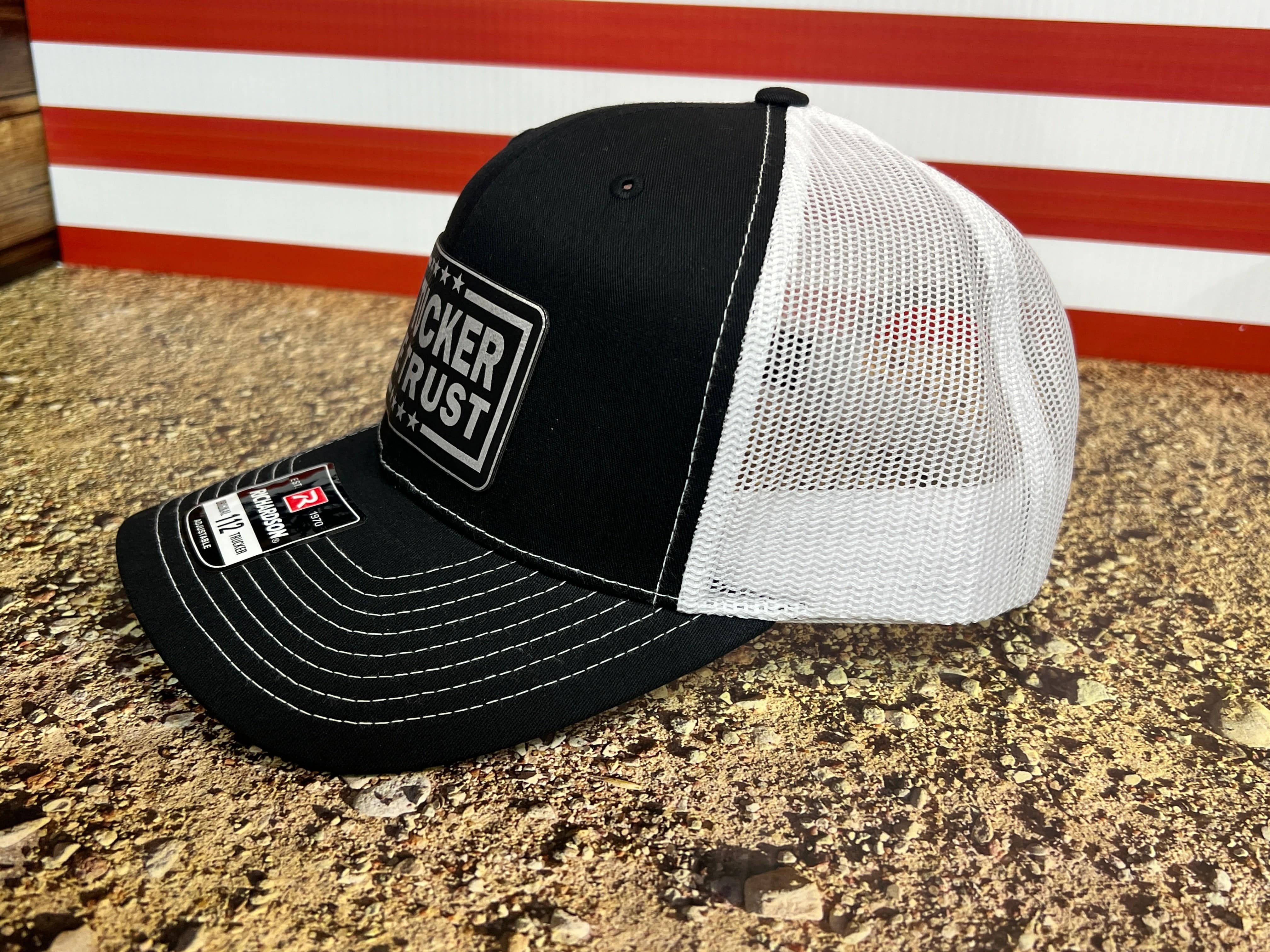 In Tucker We Trust Hat with Laser Engraved Premium Leatherette Patch on a Richardson 112 Trucker Hat. - F5 Custom Designs