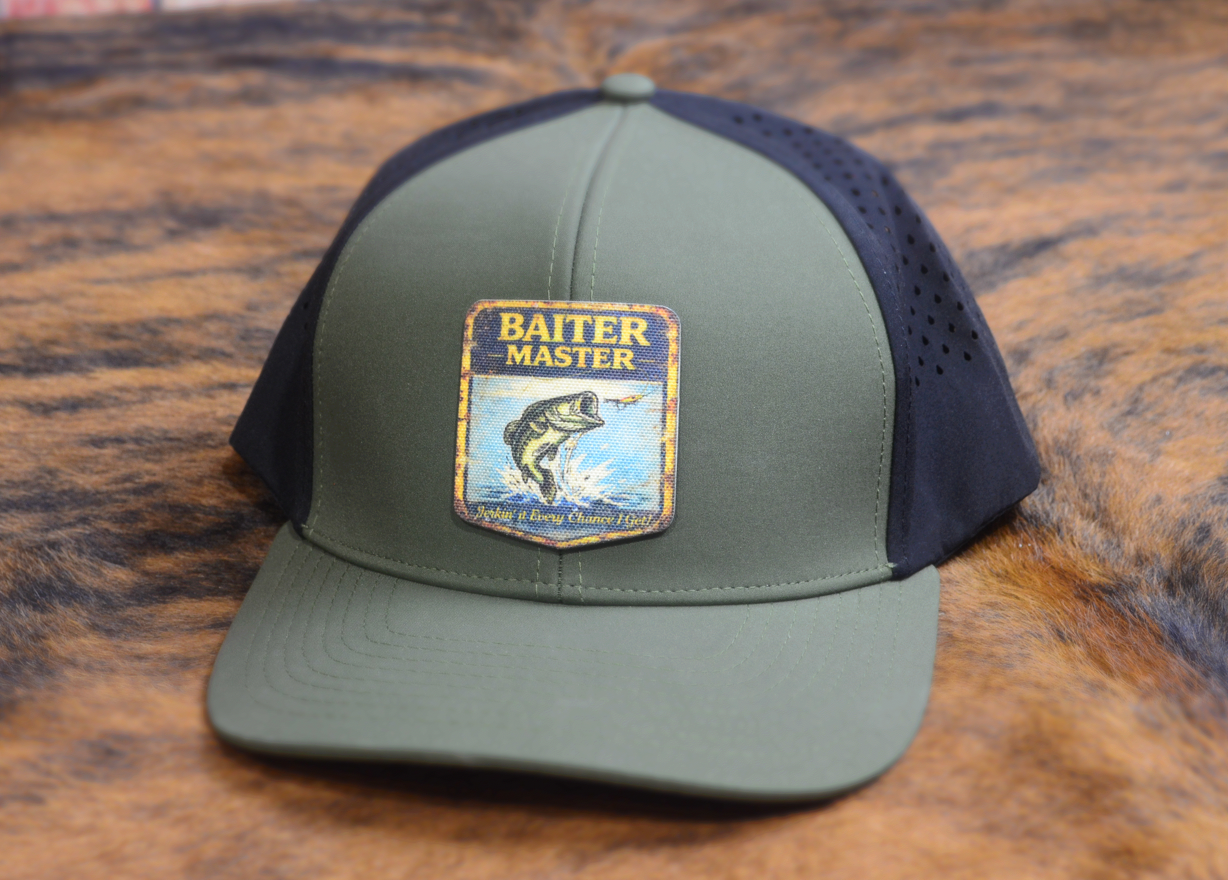 Green and black Richardson 112 with 'Master Baiter Hat' logo on a cowhide surface