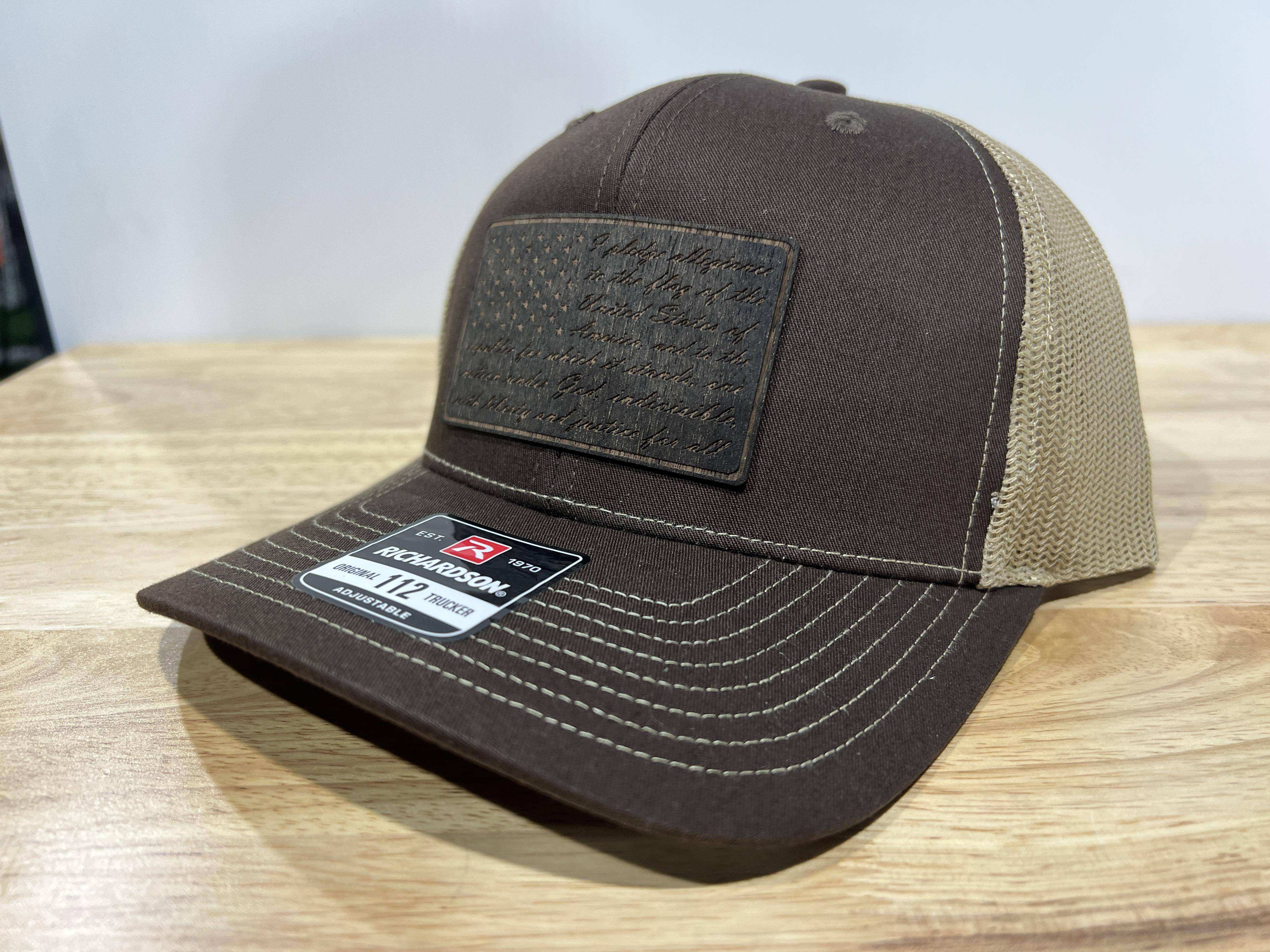 Richardson 112 trucker hat with walnut engraved wood patch featuring Pledge of Allegiance American Flag design