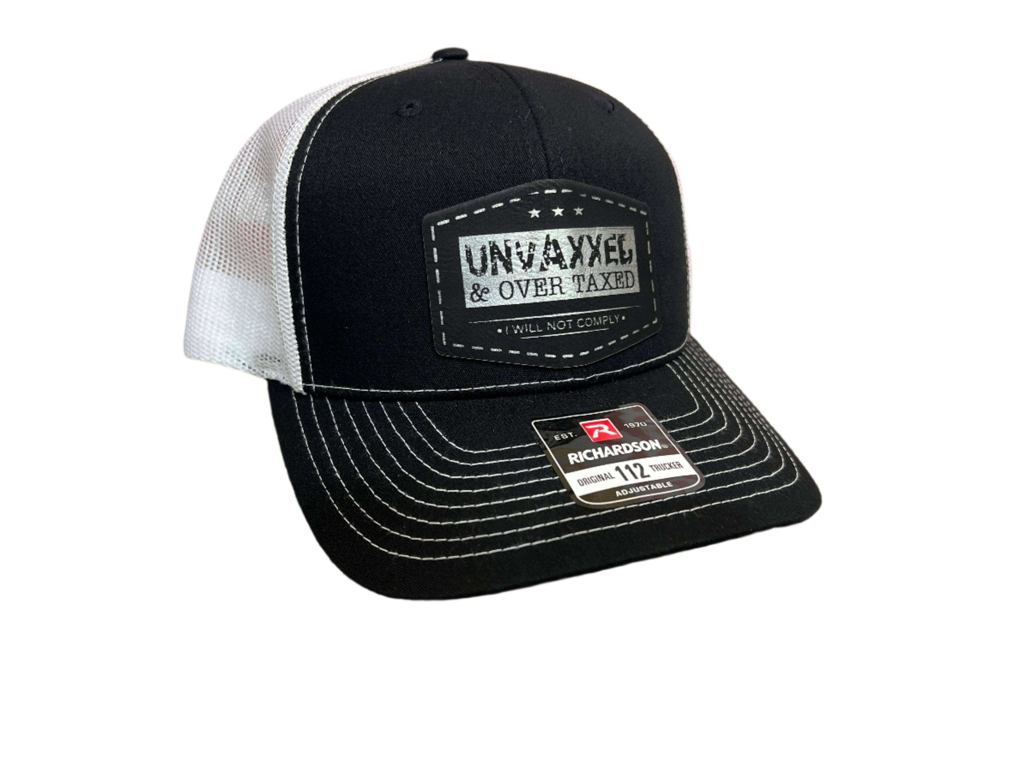 Black Richardson 112 Trucker Hat with laser engraved UNVAXXED & Over Taxed leatherette patch and adjustable snapback