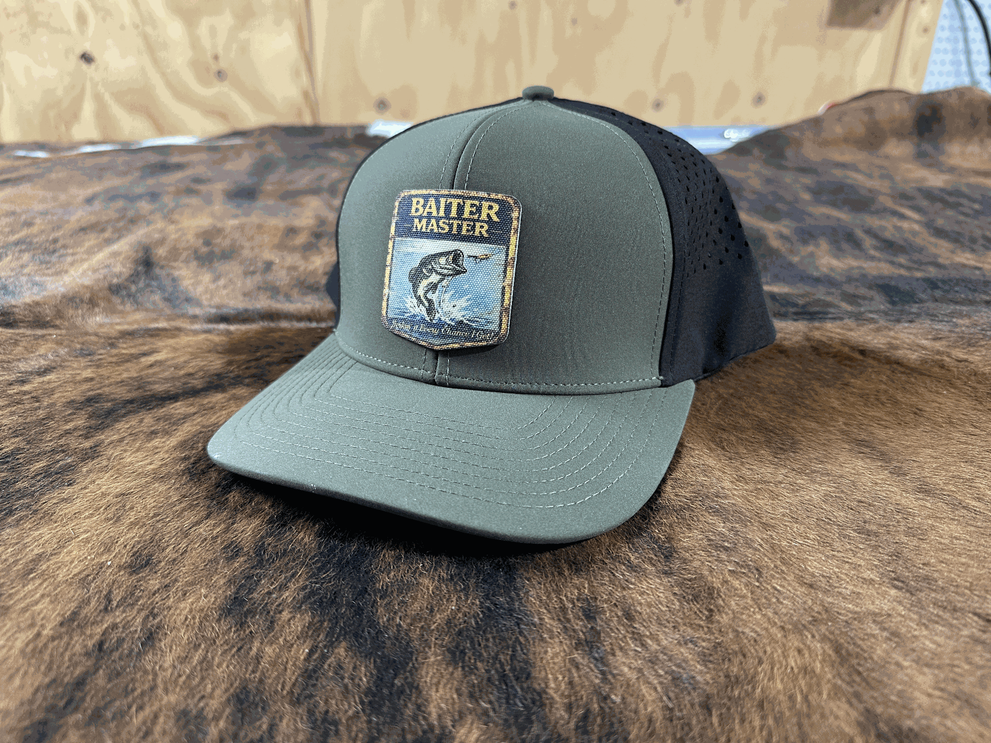 Green cap with a logo on a brown hide