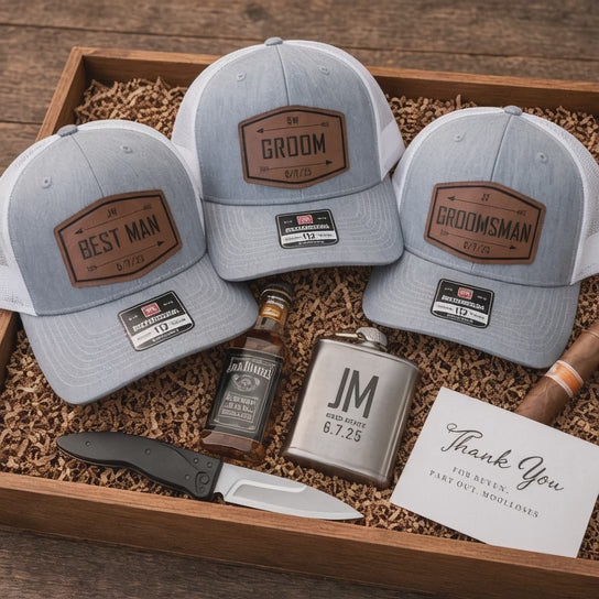 Heather gray and white Richardson 112 hats with personalized brown Groom, Best Man and Groomsman patches, displayed in a wooden wedding gift box.